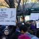 A woman holds a poster about safety pins as a sign of solidarity against intolerance during a protest against President-elect Donald Trump at Union Square in New York City on Nov. 12, 2016.
KENA BETANCUR/AFP/Getty Images